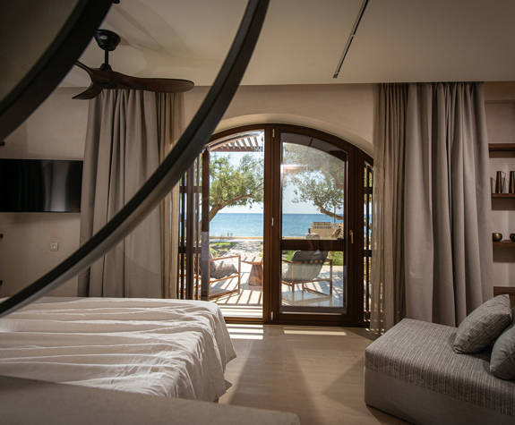The Echo Of The Sea Beachfront Villa bedroom with terrace and sea view