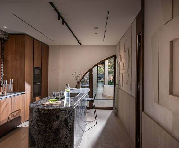 The Echo Of The Sea Beachfront Villa kitchen with amenities and terrace view