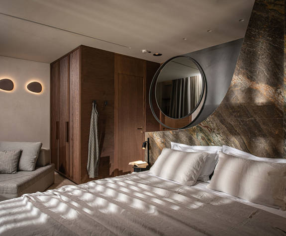 The Echo Of The Sea Beachfront Villa double bed and bedroom decorations and amenities